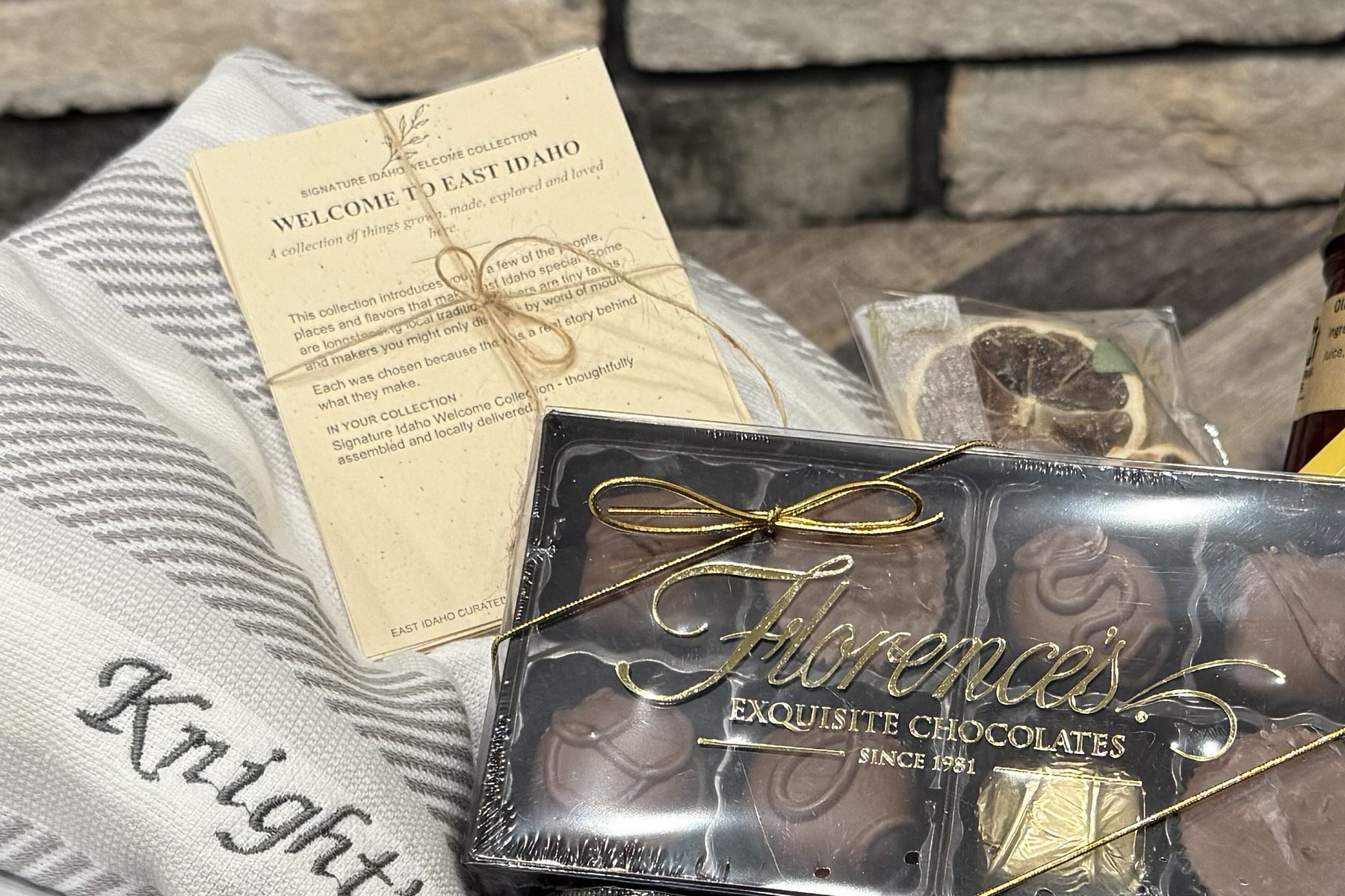 The printed East Idaho Curated welcome card tucked into a finished collection