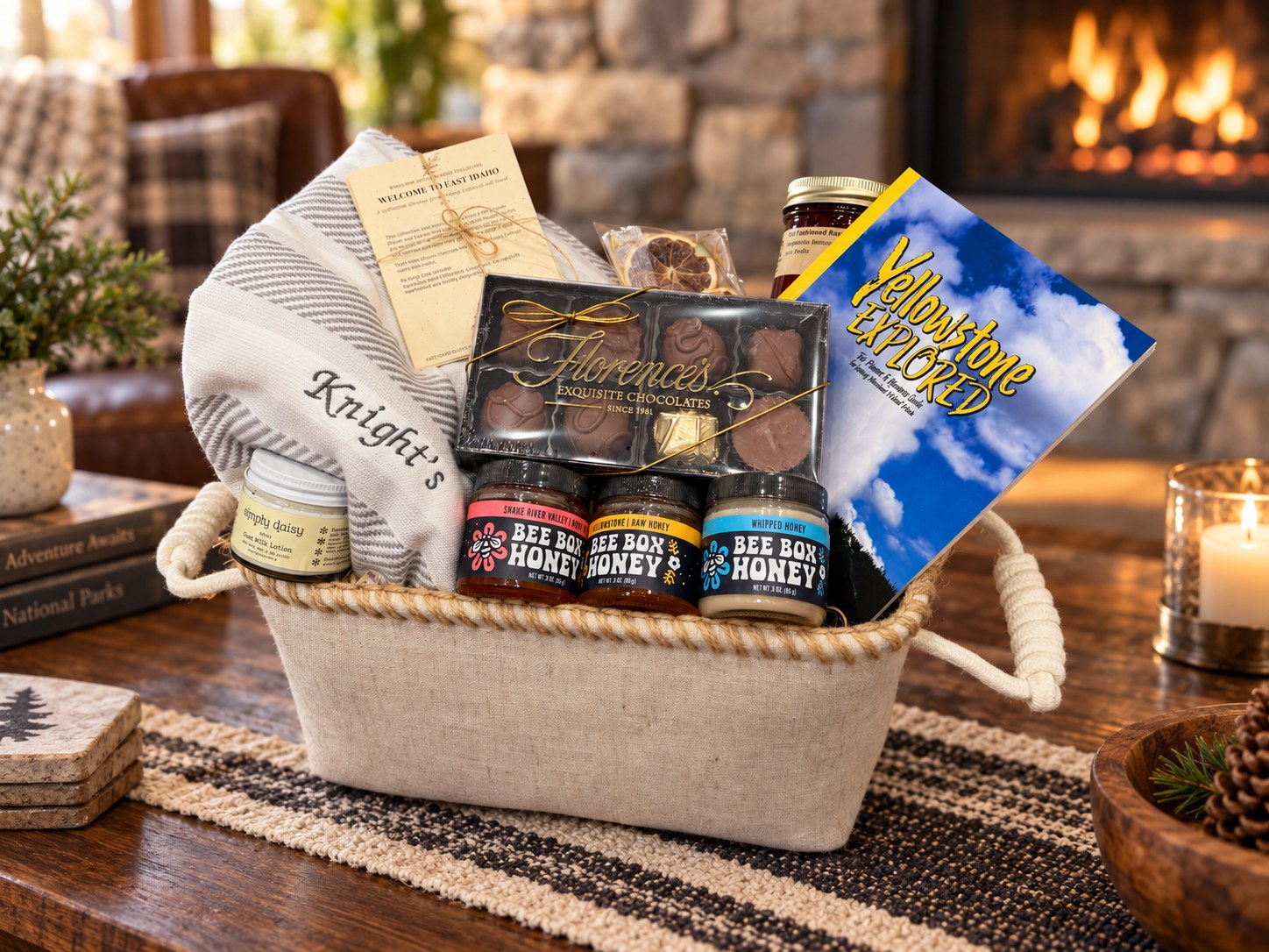 The Petite collection: monogrammed cotton hand towels with the Bee Box honey trio, Florence’s chocolates, Simply Daisy lotion, raspberry jam and the Yellowstone guide in a linen basket