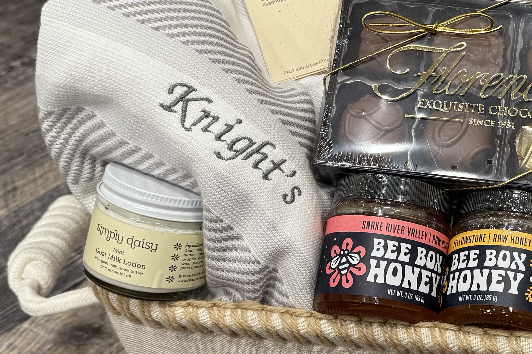 The monogrammed cotton hand towels, beside the lotion and honey