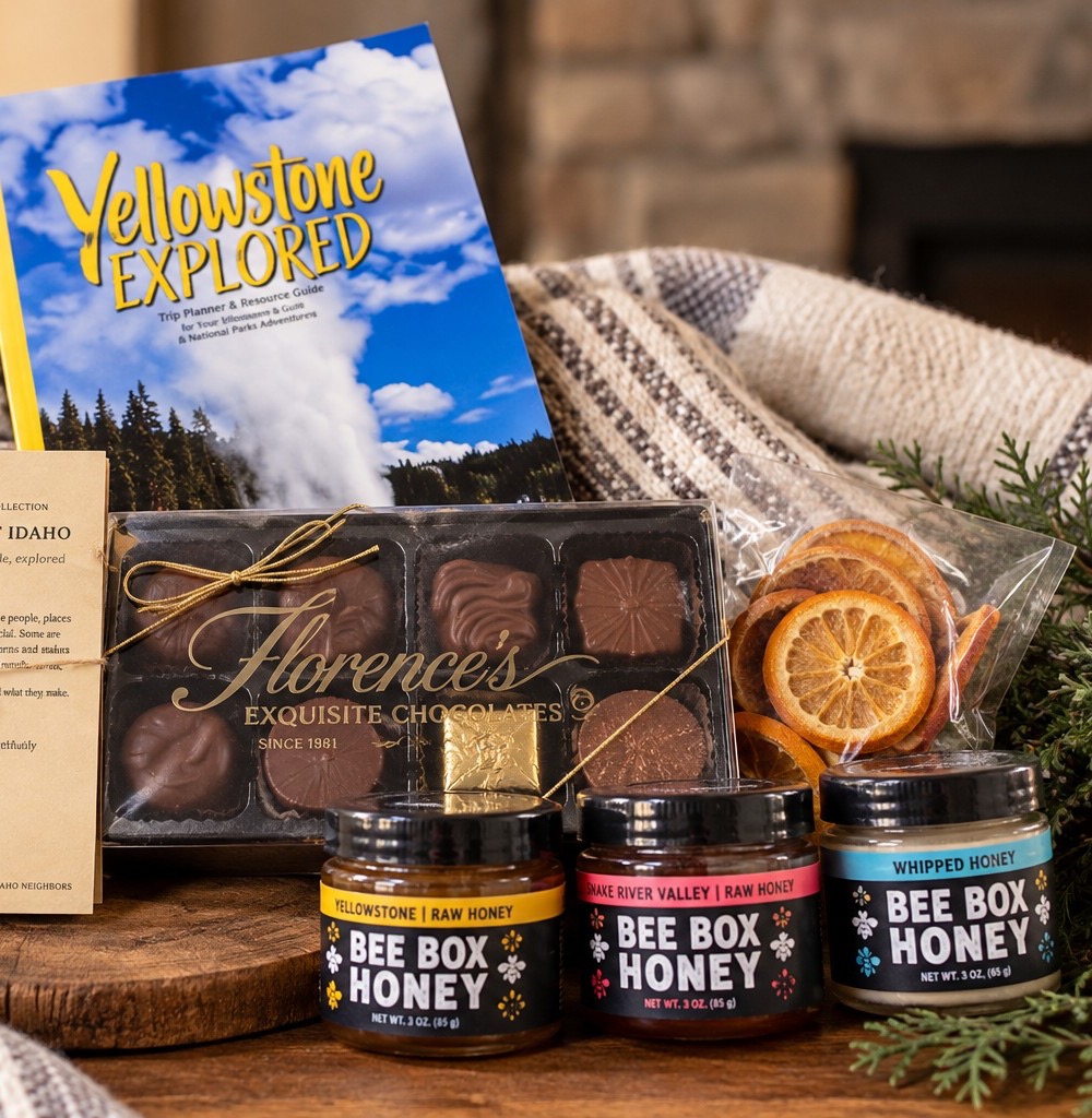 Florence’s chocolates, the three Bee Box honeys, dried orange slices and Yellowstone Explored with a wool throw and evergreen